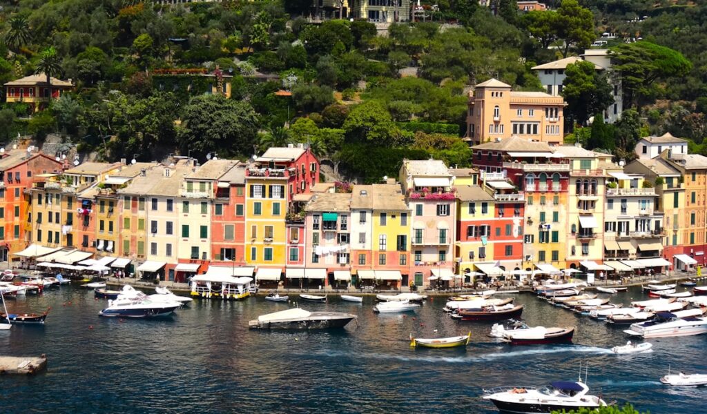 The colorful houses of Portofino reflected in the waters of the small harbor
