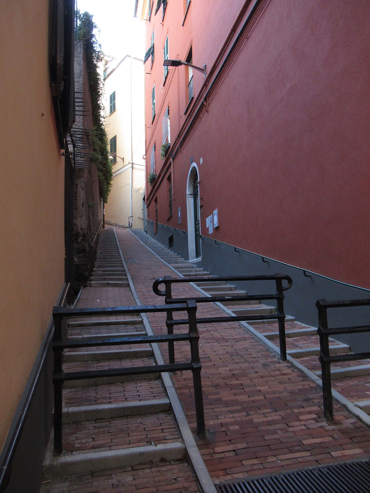 Elegant staircase climbing toward Castelletto among nineteenth-century townhouses