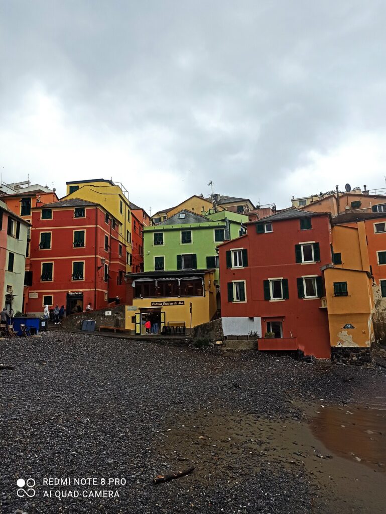 The fishing village of Boccadasse with traditional boats moored on the beach