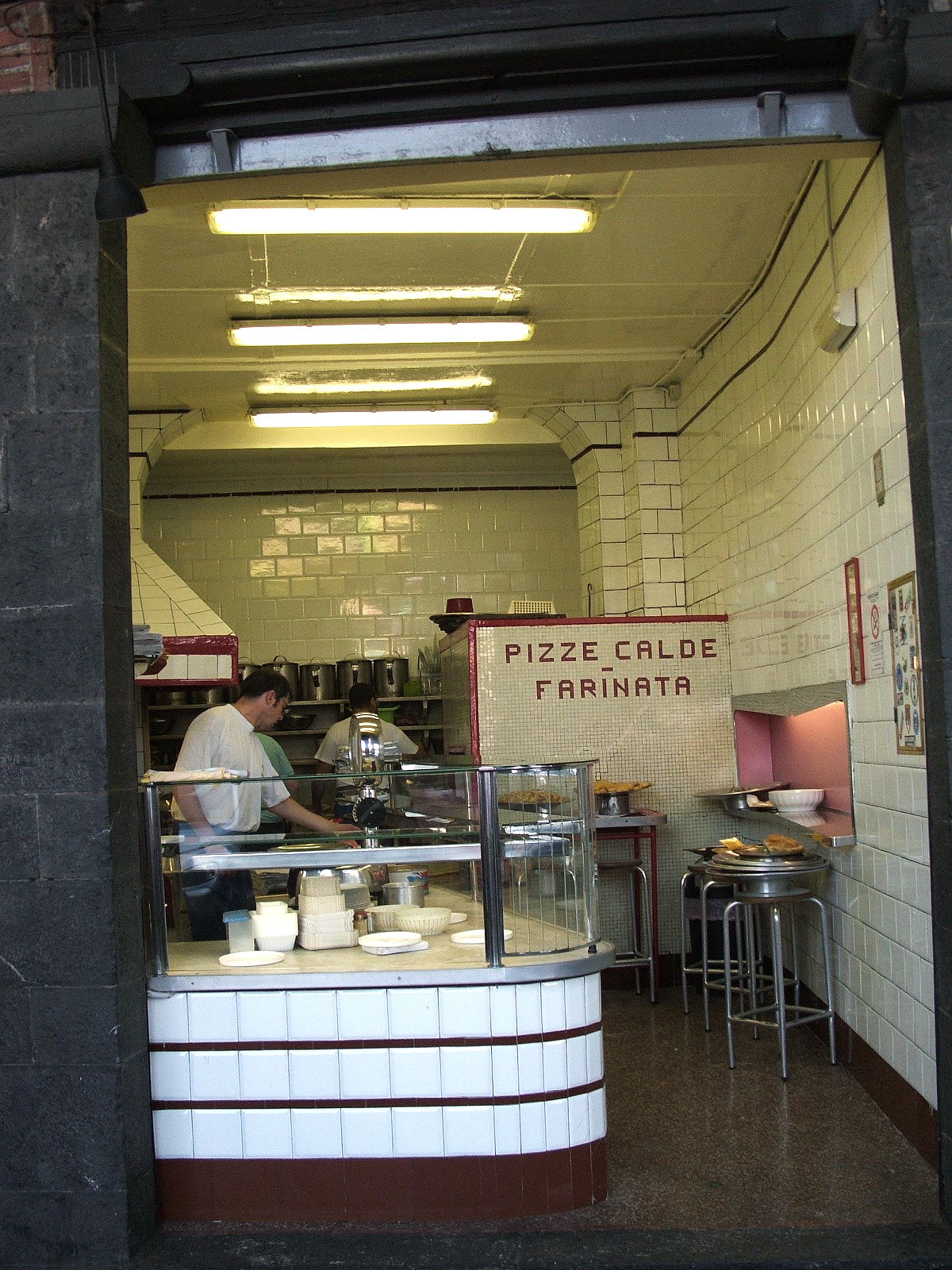 Authentic sciamadda in the Sottoripa arcades with Pizze Calde Farinata sign