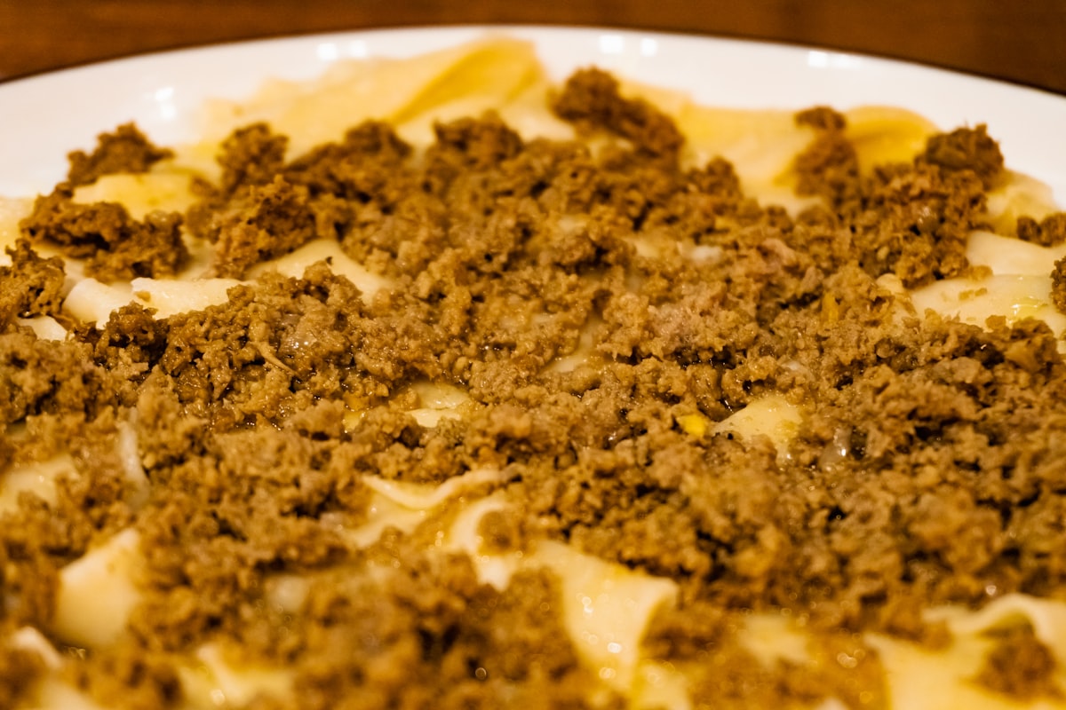 A traditional dish of agnolotti del plin served with meat sauce