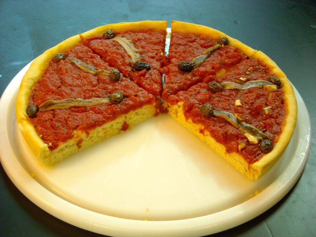 Trancio di Sardenaira con pomodoro, olive taggiasche e capperi
