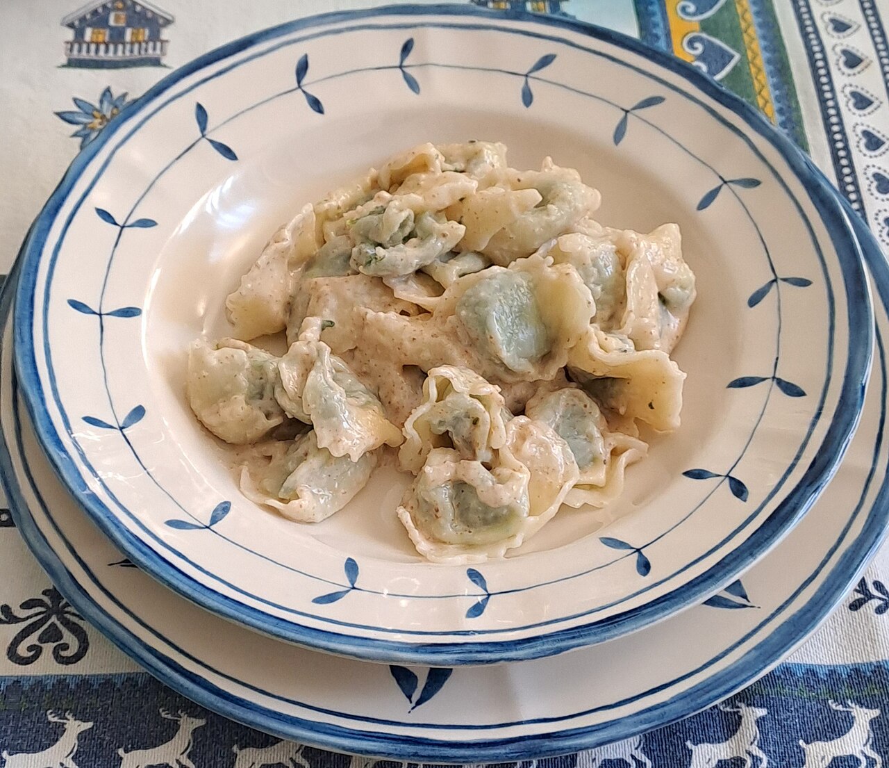 A traditional plate of pansotti dressed with walnut sauce.