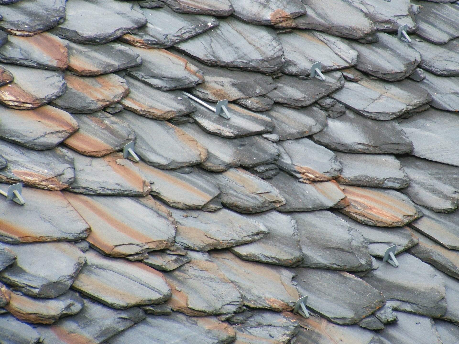 Detail of a Ligurian slate roof: overlapping slabs like scales fixed with metal hooks