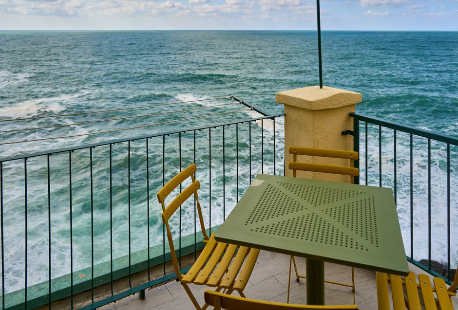 Panoramic view of Genoa's port from a balcony — high perceived value amenity for guests